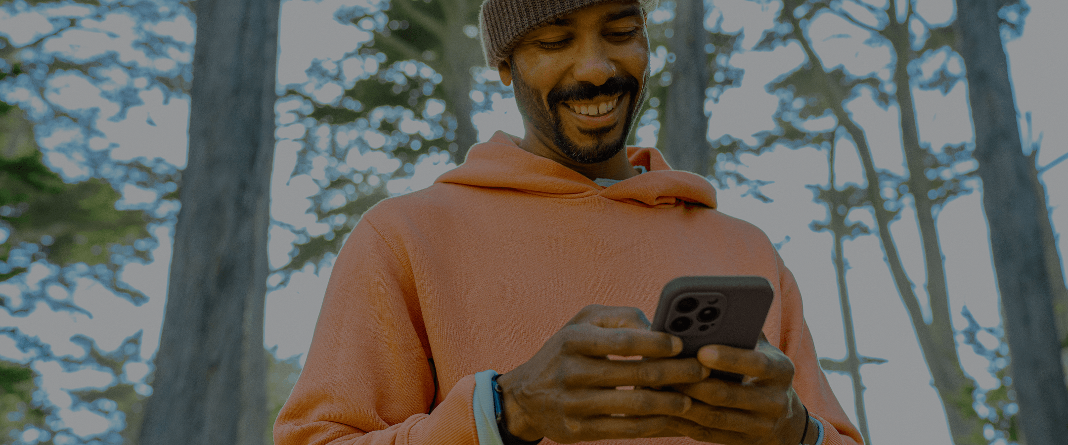 Man in Forest on Phone